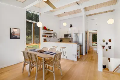 a kitchen and dining room with a table and chairs at Alpine Meadows Basecamp in Alpine Meadows
