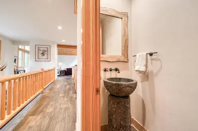 a bathroom with a stone sink on the wall at Easy Living at Northstar by Tahoe Getaways - 4BR Pet Friendly w/ Ski Shuttle & HOA in Truckee