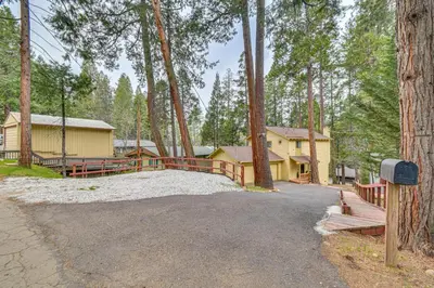 a driveway leading to a house in the woods at Less Than 1 Mi to Twain Harte Lake Forest-View Retreat! in Twain Harte