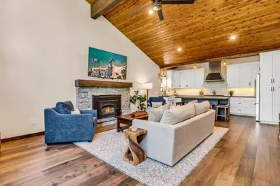 a living room with a couch and a fireplace at Little Bridge Lodge Stateline - Small Dogs Ok in Stateline