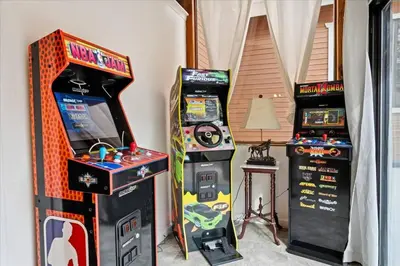 two video game machines sitting next to each other at Fun Getaway with Golf HotTub Volleyball and more in Oakhurst