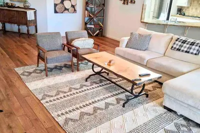 a living room with a couch and two chairs and a coffee table at Quiet Murphys getaway steps away from 25+ wineries in Murphys