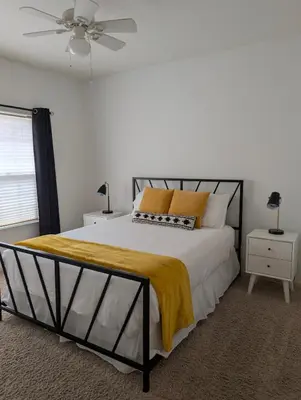 a bedroom with a bed and a ceiling fan at Quiet Murphys getaway steps away from 25+ wineries in Murphys