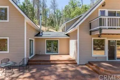 a house with a porch and a patio at Stay at Whispering Pines, only 25 mi to Yosemite! in Midpines
