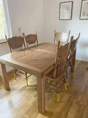 a wooden dining room table with four chairs around it at Cozy Woodworker's Cabin, 26 miles to Yosemite! in Midpines