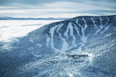 an aerial view of a mountain covered in snow and trees at Northstar Ritz-Carlton in Truckee