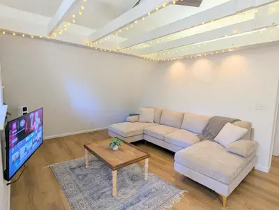 a living room with a couch and a tv at Forest Retreat that accommodates 29 people near Yosemite & Bass Lake in Oakhurst