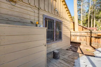 a wooden building with a gate and a fence at Close to Lake and Heavenly Mtn Resort! Quaint Cabin in South Lake Tahoe