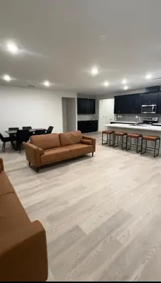 a large living room with a couch and tables at Prime Location Residence in Manteca