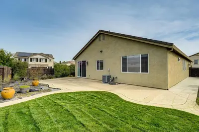a house with a lawn in front of it at Sophisticated Sanctuary 8 Mi to Lodi Wineries! in Stockton