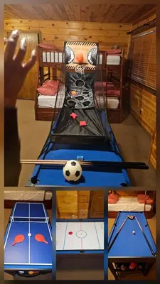 a room with a table with a soccer ball on it at Peaceful Mountain Cabin with Private Lake and Game Room Near Long Barn, California in Long Barn