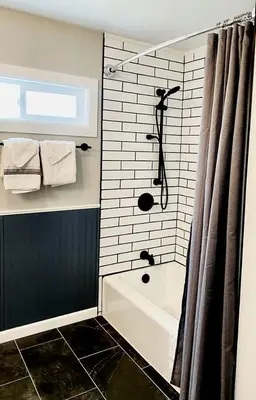 a bathroom with a shower and a bath tub at Modern Tiny Home with Mountain Views Near Mt. Whitney, Lone Pine, California in Lone Pine