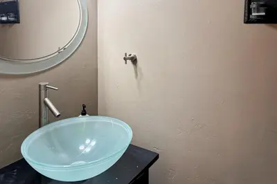 a bathroom with a blue bowl sink on a counter at Incline Village Creekside Retreat in Incline Village
