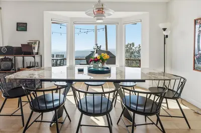 a dining room with a table and some chairs at Incredible View Near Yosemite, Spacious 4BR House! in Coarsegold
