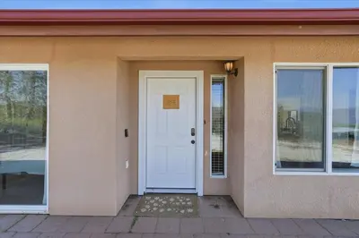 a house with a white door and windows at Incredible View Near Yosemite, Spacious 4BR House! in Coarsegold