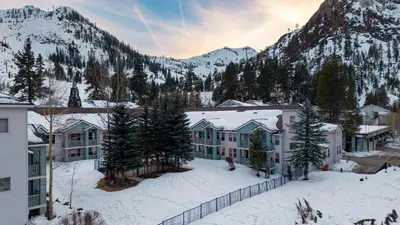 an aerial view of a resort in the snow at The Traverse by AvantStay Ski-InSki-Out Condo • Pool Hot Tub Access • Steps to KT-22 in Olympic Valley