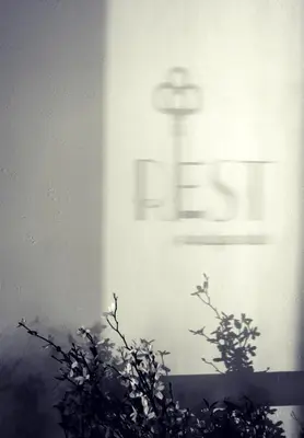 a black and white photo of a sign on a wall at Rest, a boutique hotel in Plymouth