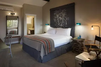 a bedroom with a bed with a chalkboard on the wall at Basecamp Tahoe City in Tahoe City