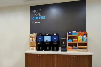 a counter with bottles of coffee on it at Holiday Inn Express & Suites Jackson by IHG in Jackson