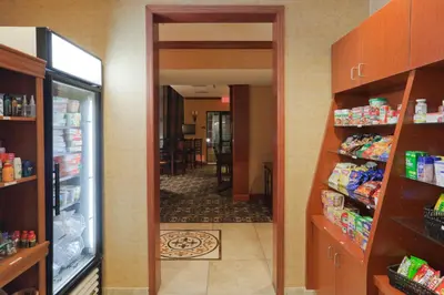 a hallway of a grocery store with a refrigerator at Staybridge Suites Rocklin - Roseville Area by IHG in Rocklin