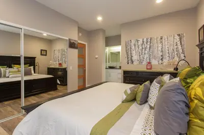 a bedroom with a large bed with a large mirror at Snowcreek #881 - Phase V in Mammoth Lakes