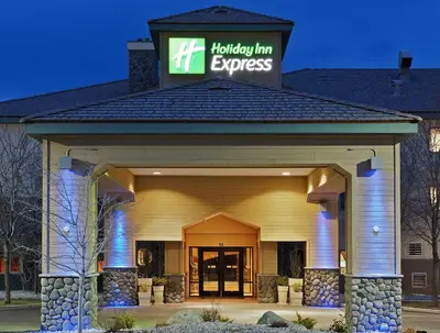 a holiday inn express building with a sign on top at Holiday Inn Express Fallon by IHG in Fallon