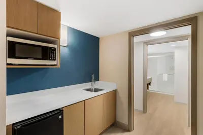 a small kitchen with a sink and a microwave at Holiday Inn Express Fallon by IHG in Fallon