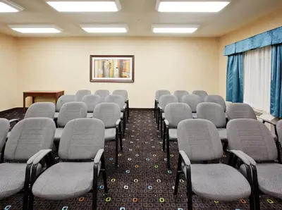 a room with rows of chairs in a classroom at Holiday Inn Express Fallon by IHG in Fallon