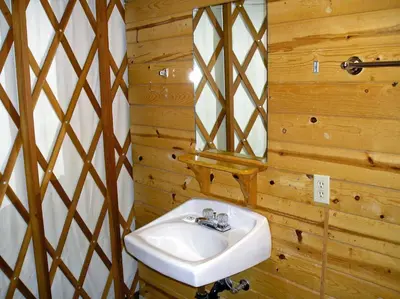 a bathroom with a sink and a mirror at Yosemite Lakes Hillside Yurt 1 in Harden Flat