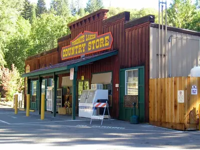 a building with a sign that reads survival store at Yosemite Lakes Meadow Yurt 15 in Harden Flat