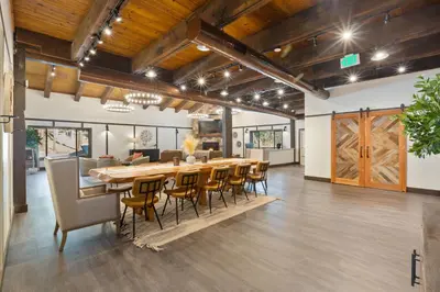 a large dining room with a long table and chairs at Yosemite Lakes Bunkhouses in Harden Flat