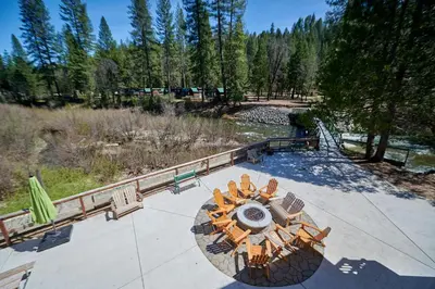 an overhead view of a patio with chairs and a table at Yosemite Lakes Cabin & Cottages in Harden Flat