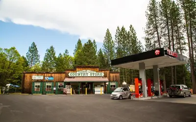 a gas station with a car parked in front of it at Yosemite Lakes Wheelchair Accessible Cabin 46 in Harden Flat