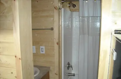 a bathroom with a shower and a sink at Yosemite Lakes Wheelchair Accessible Cottage 53 in Harden Flat