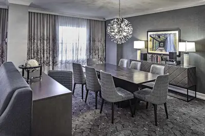 a dining room with a table and chairs at DoubleTree by Hilton Modesto in Modesto