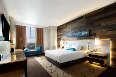 a hotel room with a bed and a desk at Chukchansi Gold Resort & Casino in Coarsegold