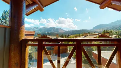 a view of a mountain from a balcony of a house at Juniper Crest 1 Apartment in Mammoth Lakes