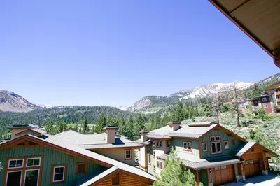 a group of houses with mountains in the background at Juniper Crest 6 Apartment in Mammoth Lakes