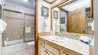 a bathroom with a sink and a shower and a toilet at Mammoth Reservations in Mammoth Lakes