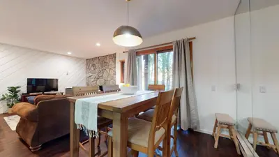 a dining room with a table and some chairs at Snowcreek 441 Apartment in Old Mammoth