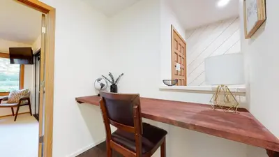 a kitchen with a wooden counter and a chair at Snowcreek 441 Apartment in Old Mammoth