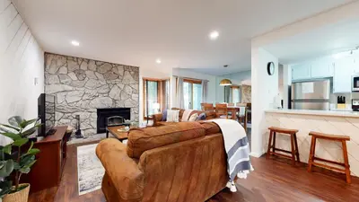 a living room with a couch and a fireplace at Snowcreek 441 Apartment in Old Mammoth