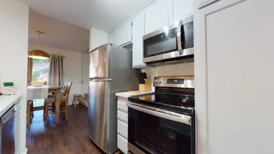 a kitchen with a stove and a refrigerator at Snowcreek 441 Apartment in Old Mammoth