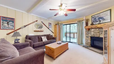 a living room with a couch and a fireplace at Summit 3 Apartment in Mammoth Lakes