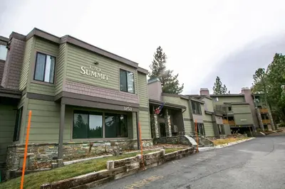 a row of houses on a street with a building at Summit 45 Apartment in Mammoth Lakes