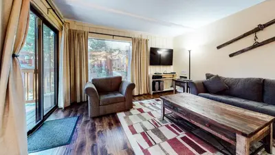 a living room with a couch and a coffee table at Summit 49 Apartment in Mammoth Lakes