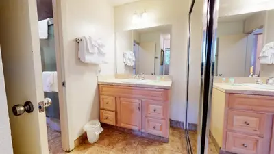 a bathroom with two sinks and a shower at Mammoth Reservations in Mammoth Lakes