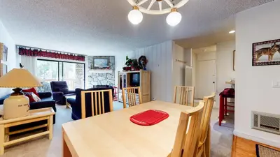 a kitchen and living room with a table and chairs at Mammoth Reservations in Mammoth Lakes