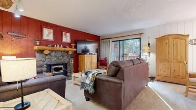 a living room with a couch and a fireplace at Rustic Summit 237 On Free Shuttle Route in Mammoth Lakes