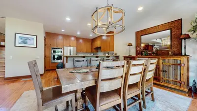 a kitchen and dining room with a table and chairs at Timbers 18 Apartment in Mammoth Lakes